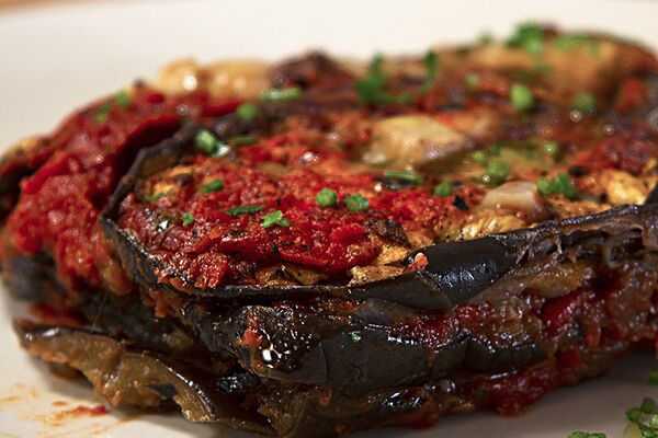 Parmigiana di melanzane con fagioli all'uccelletto